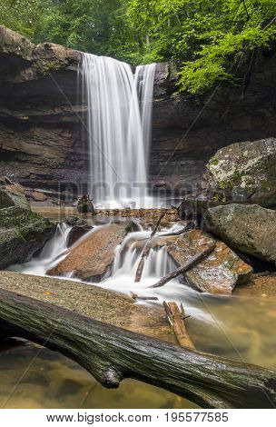 As viewed from downstream Cucumber Falls plunges over a cliff on its way to the nearby Youghiogheny River.