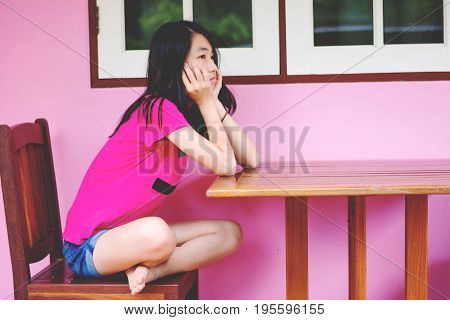 Depress And Hopeless Girl Sitting Outdoor, Absent Minded