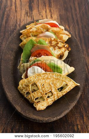 Pancakes Sutffed With Ham, Cheese, Tomatoes And Spinach