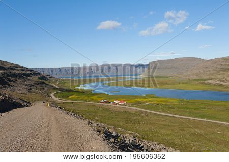 Extremely beautiful bay with mighty fjords mountains and turquise sea in the West Fjords, Iceland. Panoramic photo