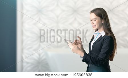 Young Beautiful Business Woman And Creative Designer Standing Over Blured Interior Background