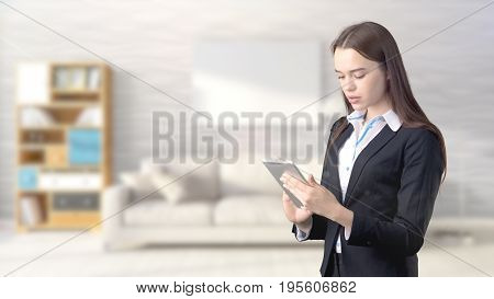 Young Beautiful Business Woman And Creative Designer Standing Over Blured Interior Background