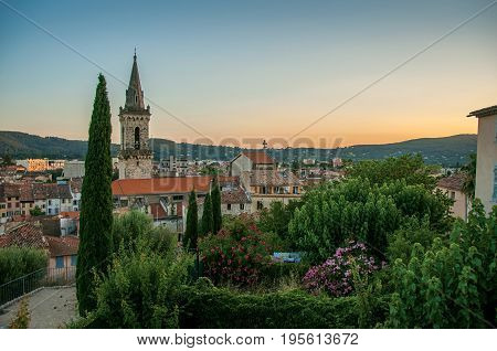 View of the graceful town of Draguignan from the hill of the clock tower under the colorful light of the sunset. Located in the Provence region, Var department, southeastern France