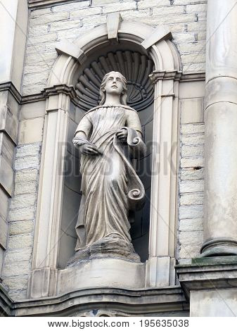statue of a muse on a victorian theater building in Halifax England