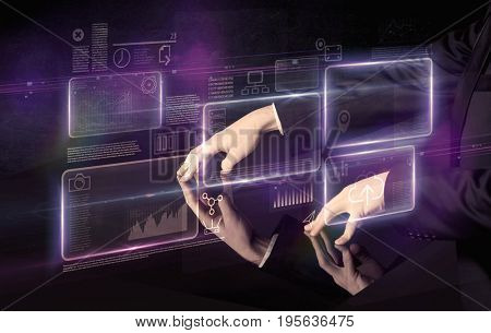 Male hands touching interactive table with purple cloudspace graphic on it 