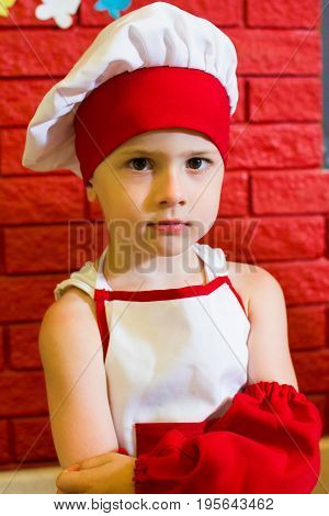 Alchevsk, Ukraine - July 16, 2017: Children's Master Class On Cooking Potatoes In The Oven With Ham 