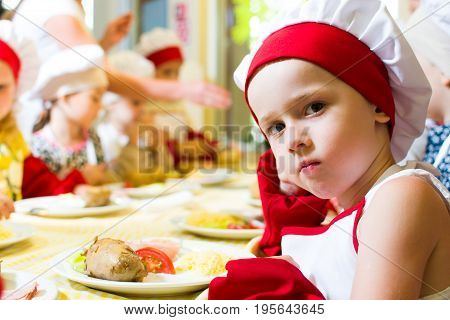 Alchevsk, Ukraine - July 16, 2017: Children's Master Class On Cooking Potatoes In The Oven With Ham 