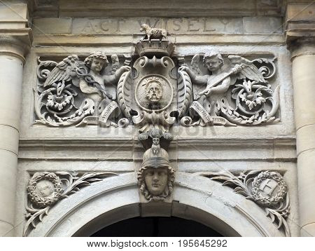 ornate stone carving above the main door of halifax town hall in yorkshire