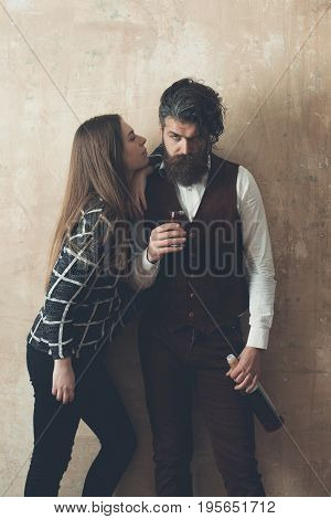Girl With Man Holding Bottle And Glass Of Wine