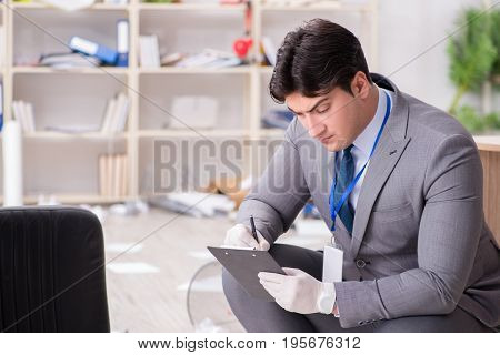 Young man during crime investigation in office