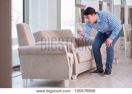Young man shopping in furniture store