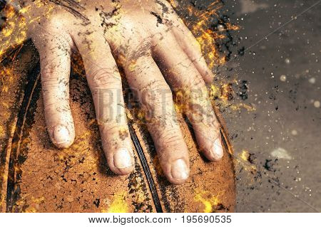 fragment of a basketball ball in a hand fire illustration.