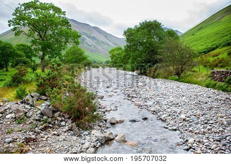Lake District National Park, path to Scafell Pike, view of the mountains, stream, England, selective focus