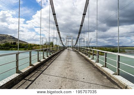 Laugaras Bridge is a suspension bridge and road bridge that was completed in 1958. The river is the river Olfusa