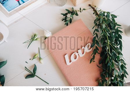Wooden White Word Love On Pink Papperbook And Eucalipt