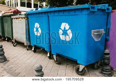 Garbage containers standing in a row. Waste storage