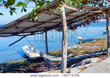 View of a pier and boats in the town of Champoton Mexico