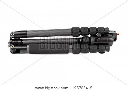Folded photographic tripod isolated on white background