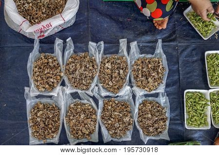 View of Schizophyllum commune mushroom Common Split Gill in the market Tamu in Keningau,Sabah.Its a place where all farmers,fishermen & vendors gathers weekly to sell their products