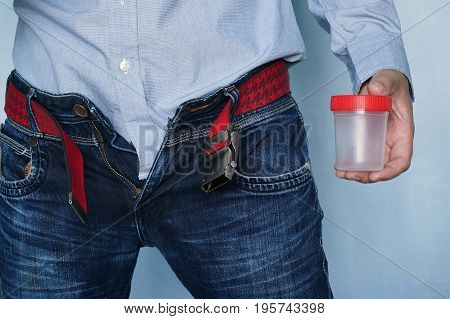 Man from empty jar for  analyzes at hands at hospitals.