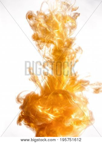 Ink swirl in a water on white background. The paint splash in the water. Soft dissemination a droplets of colored ink in water close-up. Abstract background. Explosion of color splashes acrylic ink.