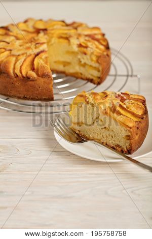 Homemade delicious aromatic peach pie. Selective focus.