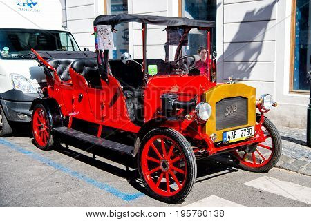 PRAGUE CZECH REPUBLIC - June 3 2017: vintage Ford car parked on the Prague street offering sightseeing tours for tourists