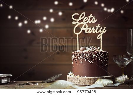 Chocolate birthday cake in a party setting