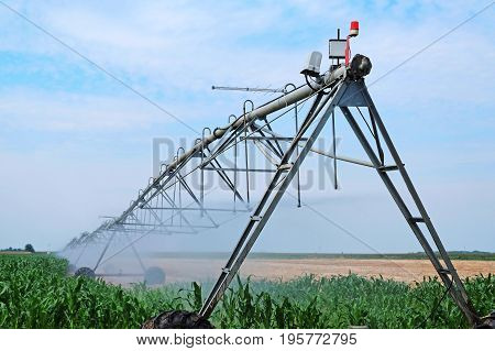 Modern sprinkler irrigation system on agriculture field