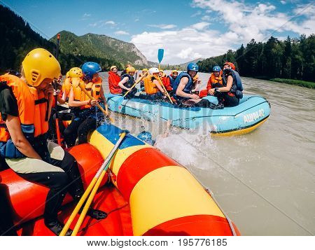mountain Altai, RUSSIA - July 16, 2017: group of friends' friends sail on a boat in life jackets and helmets., rafting