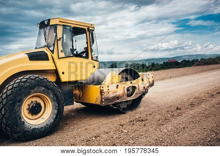 Close Up Details Of Industrial Roadworks With Tandem Roller And Vibratory Soil Compactor