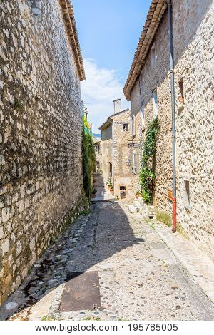 typical narrow street with tourists in St Paul de Vence France.