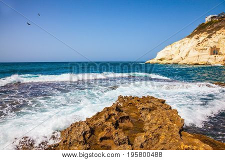 The grottoes of Rosh Ha Nikra. Rocks of white limestone on the shores of the Mediterranean Sea. Geological phenomenon in the north of Israel, on the border with Lebanon