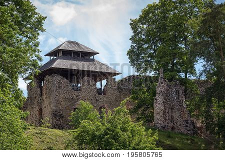 Ruins of the medieval castle with a view tower in Rauna, Latvia