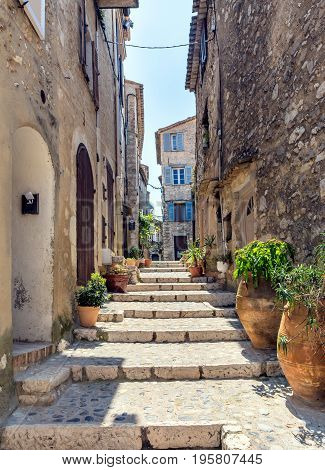 typical narrow street with tourists in St Paul de Vence France.