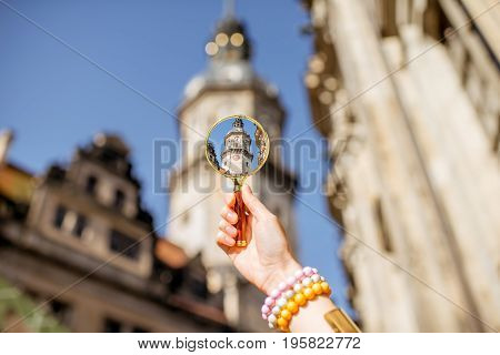 Watching though a magnifying glass on the Hausmannsturm tower of the old castle in Dresden, Germany