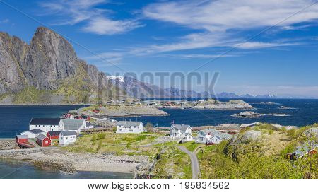 Island of Hamnoy, in northern Norway. The Norwegian fishing village with the typical rorbu houses.  Mountain In Background