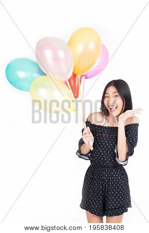 Young Beautiful Asian Woman Holding Colorful Balloon With Happy Emotion And Fun Isolated On White Ba