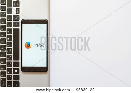 Los Angeles, USA, july 18, 2017: Firefox logo on smartphone screen placed on the laptop on white background.