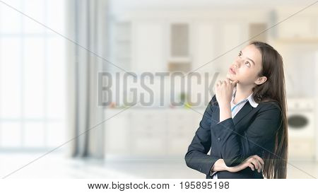 Young Beautiful Business Woman And Creative Designer Standing Over Blured Interior Background