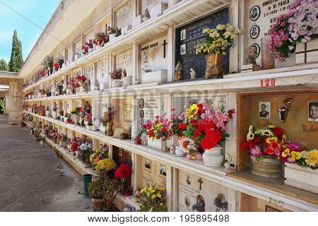 ROME ITALY - JULY 2 2017: Christian Concrete loculi tombs in the Verano cemetery burial recess built in the seventies