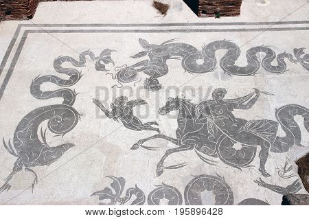 OSTIA ANTICA ITALY - JULY 2 2017: lavacrum ostiense an ancient Roman Mosaic Floor in the Neptune Baths