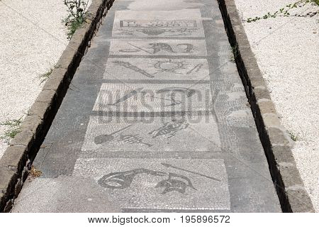 OSTIA ANTICA ITALY - JULY 2 2017: Mithraeum steps to enlightenment an ancient Roman Mosaic Floor in a Mithraic mysteries temple