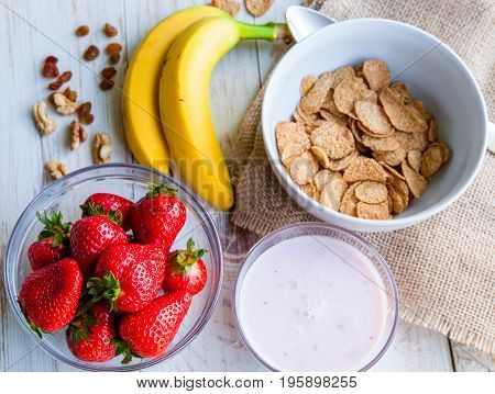Healthy Breakfast which included cornflakes and oatflakes, yogurt, bananas and strawberries