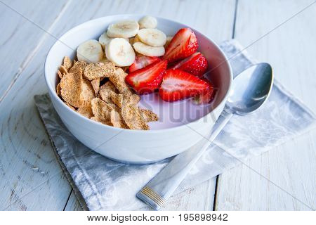 Healthy Breakfast which included cornflakes and oatflakes, yogurt, bananas and strawberries