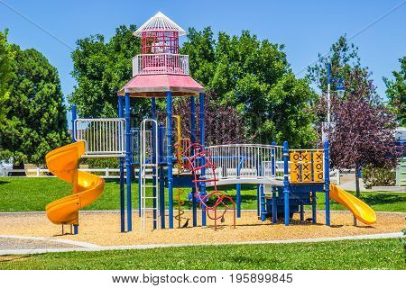 Children's Playground In Small Local Park Setting