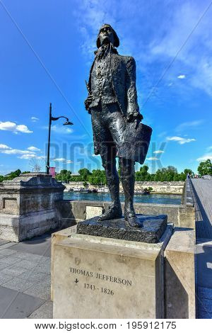 Paris, France - May 16, 2017: Bronze statue of Thomas Jefferson near the Jardin des Tuileries garden and the Pont Solferino in Paris.