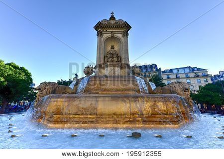 Paris, France - May 16, 2017: The Fountain Saint-Sulpice or Fountain of the Four Bishops built in the center of Place Saint Sulpice between 1844 and 1848 in Paris France.