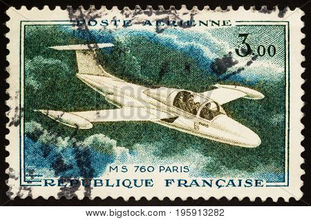 Moscow Russia - July 19 2017: A stamp printed in France shows aircraft MS 760 Paris - French four-seat jet trainer and liaison aircraft by Morane-Saulnier (1954) circa 1960