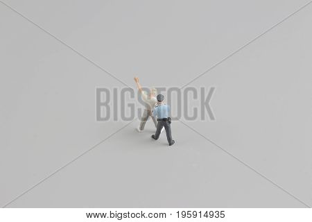 Mini Figure Of Policeman With Hand Cuffs